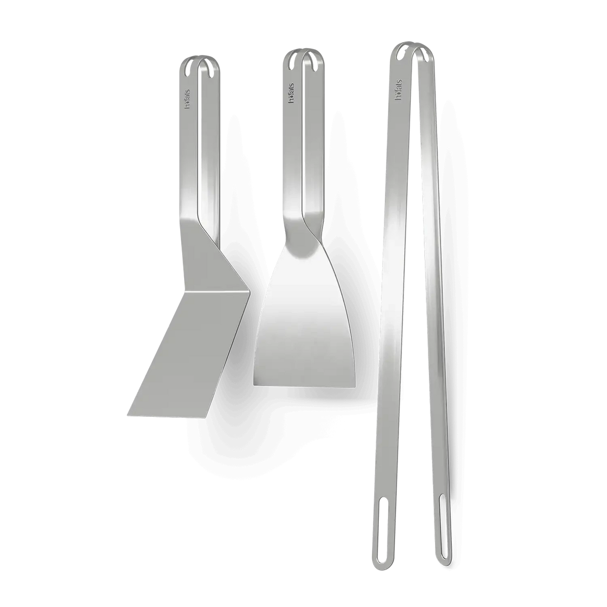 Höfats Grill Tool Set consisting of grill tongs, grill scraper, and spatula