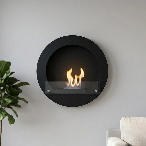 Round black wall-mounted bioethanol fireplace in a bright Scandinavian living room, lit flame