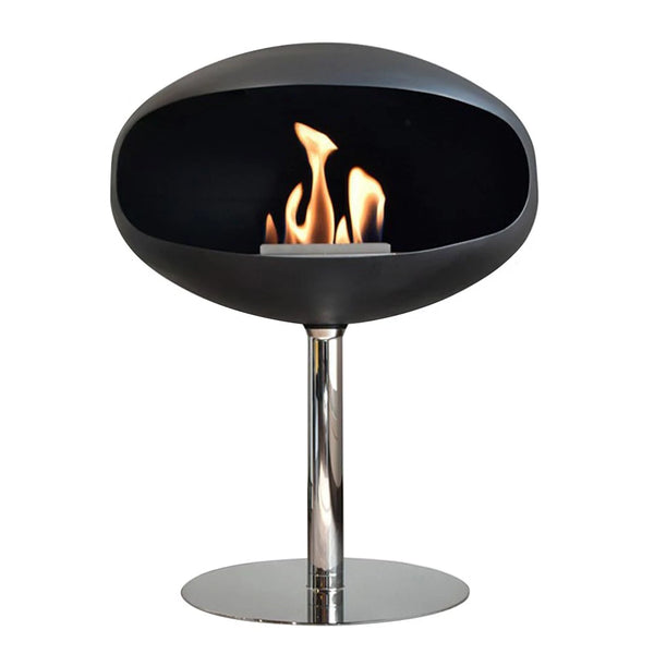Laissez-vous envelopper par la chaleur du Cocoon Pedestal – finition noir mat et piètement en acier, une cheminée bioéthanol raffinée pour sublimer votre intérieur.