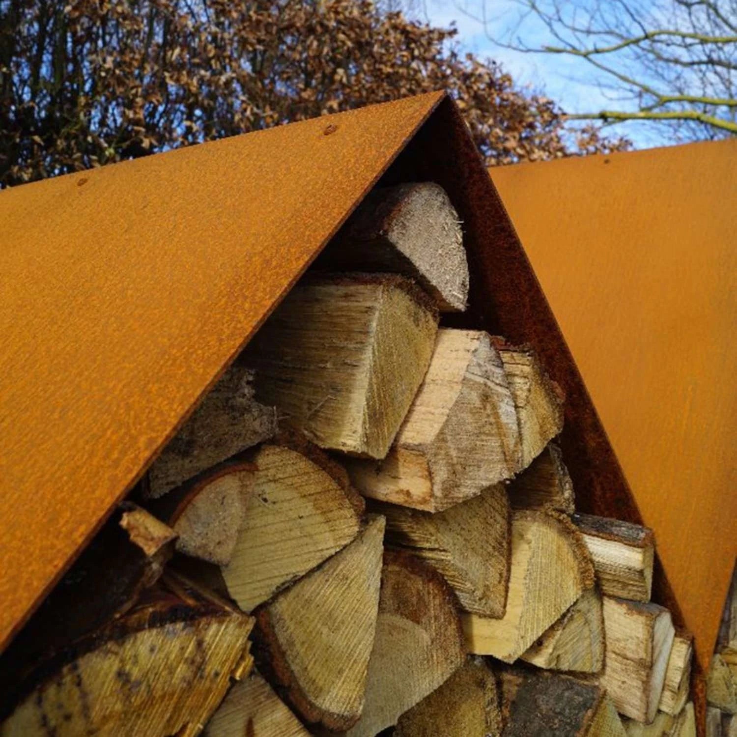 Bruges 3 Houses Log Storage, a spacious and durable solution for storing firewood in outdoor spaces like gardens and patios.